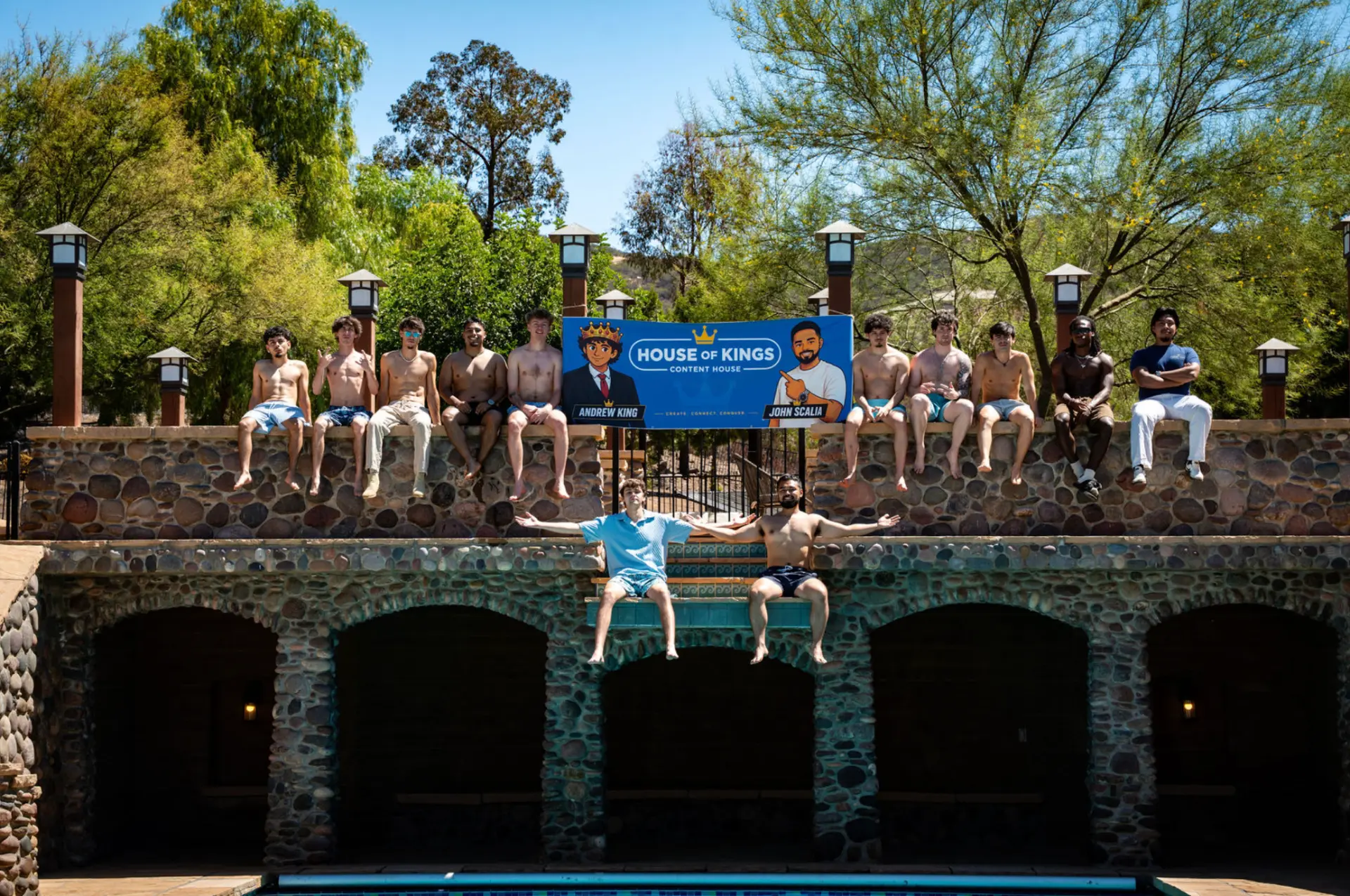 House of Kings creators gathered beside the pool